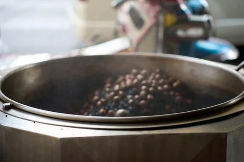 Fresh aromatic coffee beans being roasted, Thailand, 31 January, 2025 Stock Photos