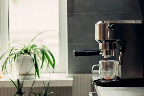 Fresh aromatic coffee at home using a modern coffee maker Stock Photos