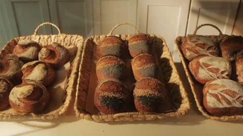 Fresh artesian bread on bakery shop close-up. Bread with black poppy garnish on Stock-Footage 266830929