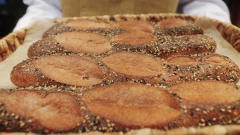 Fresh Artezan bread close-up. Artisan bread is making by skill bakers using Stock Footage 275099976