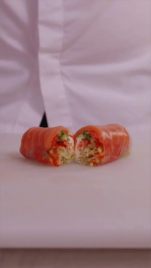 Fresh asian spring roll cut in half showing rich vegetable filling Stock Footage 337119156