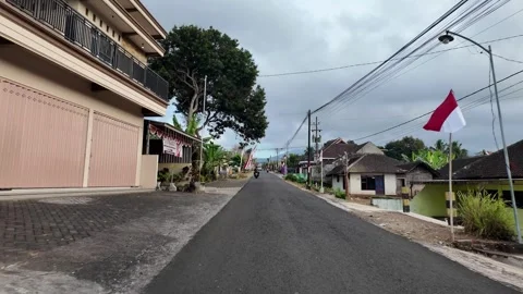 Fresh asphalt stretches down a quiet village lane Stock Footage 345157851