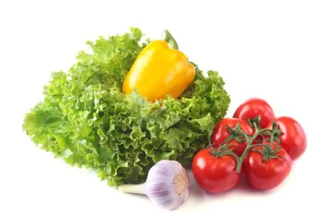 Fresh assorted vegetables bell pepper, tomato, garlic with leaf lettuce Stock Photos