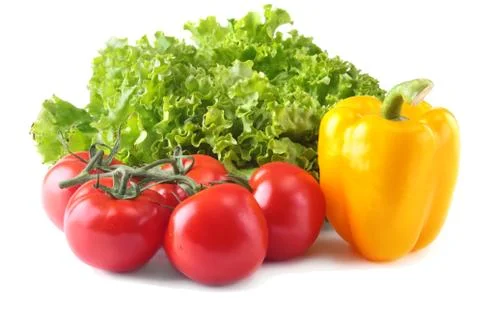 Fresh assorted vegetables bell pepper, tomato, garlic with leaf lettuce Stock Photos