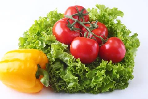 Fresh assorted vegetables bell pepper, tomato, garlic with leaf lettuce Stock Photos