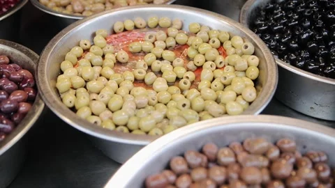 Fresh assortment of different variation of olives. Bunch of olives that is in Stock Footage 273915852