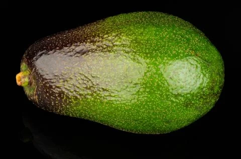 Fresh avocado on black surface ready for use in meals Stockfoto's
