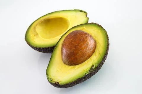 Fresh avocado on white background. Selective focus Stock Photos