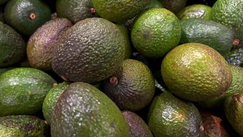 Fresh avocados on a textured background Stock-Footage 332397280