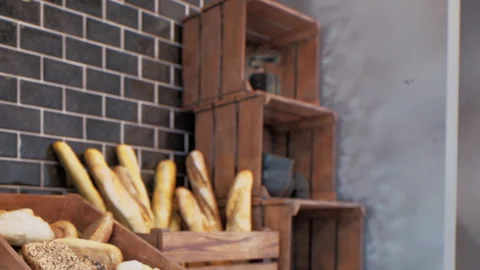 Fresh Baguettes and Bread in Bakery Wooden Crates Stock Footage 348488237