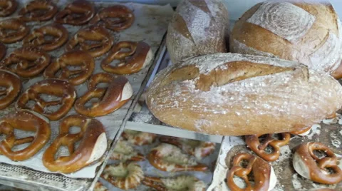 Fresh Baked Bread And Pretzels Pan  Across - 4K Stock Footage 51328131