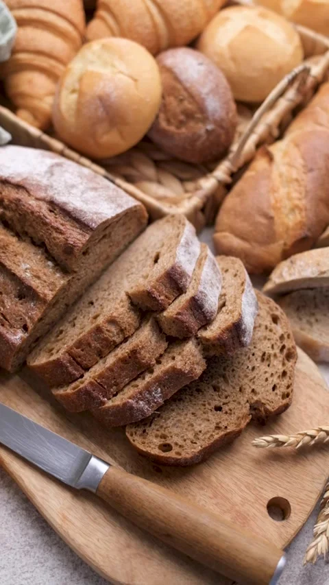 Fresh baked bread assortment on a kitchen counter Stock Footage 336308021