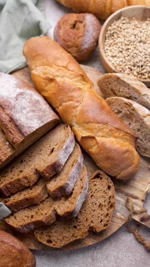Fresh baked bread assortment on a kitchen counter Stock Footage 336677009