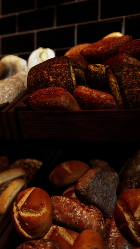Fresh baked bread is displayed in a bakery during the morning hours Stock Footage 339105051