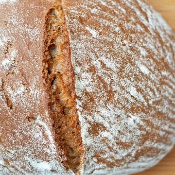 Fresh baked bread dusted with flour 스톡 사진