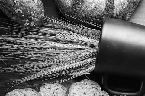 Fresh baked bread with ears of wheat. Wheat yellow. Breakfast is Stock Photos