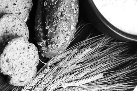 Fresh baked bread with ears of wheat. Wheat yellow. Breakfast is Stock Photos