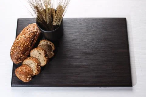 Fresh baked bread with ears of wheat. Wheat yellow. Breakfast is Stock Photos