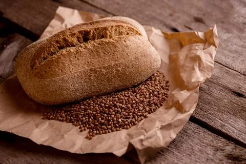 Fresh baked crispy bread on an old rustic wooden table. French bread. Bakery Stock Photos