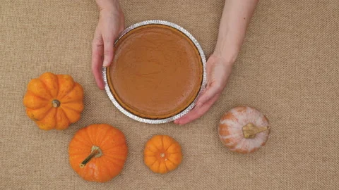 Fresh baked pumpkin pie in disposable baking pan Stock Footage 149404895