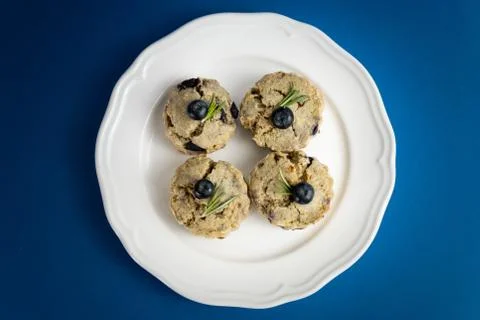 Fresh Baked Raspberry and Blueberry oatmeal wheat Scones set on Blue Backgrou Foto stock