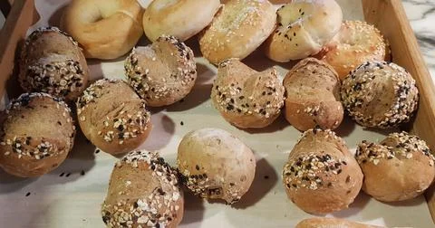 Fresh Baked soft bread rolls and hard bread rolls. Warm Fresh Buttery Rolls. Stock Photos