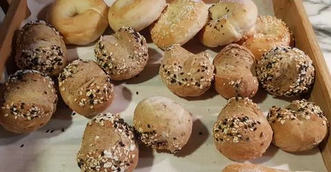 Fresh Baked soft bread rolls and hard bread rolls. Warm Fresh Buttery Rolls. Stock Photos