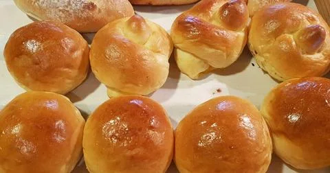 Fresh Baked soft bread rolls and hard bread rolls. Warm Fresh Buttery Rolls.. Stock Photos