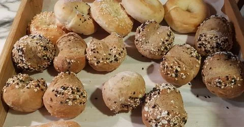 Fresh Baked soft bread rolls and hard bread rolls. Warm Fresh Buttery Rolls.. Stock Photos