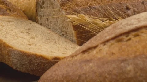 Fresh baked whole grain bread move in slow motion. Stock Footage 150531821