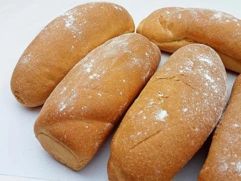 Fresh bakery bread rolls sprinkled with flour Stock Photos