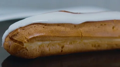 Fresh from the bakery - French Eclair pastry Stock Footage 71740089