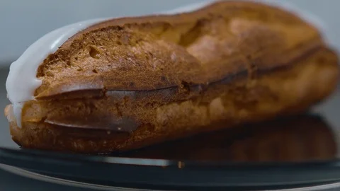 Fresh from the bakery - French Eclair pastry Stock Footage 71740595
