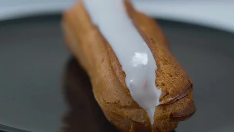 Fresh from the bakery - French Eclair pastry Stock Footage 71745471