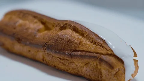Fresh from the bakery - French Eclair pastry Stock Footage 71745722