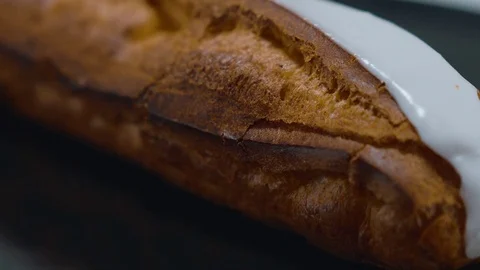 Fresh from the bakery - French Eclair pastry Stock Footage 71745902