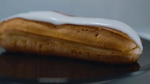 Fresh from the bakery - French Eclair pastry Stock Footage 71746099