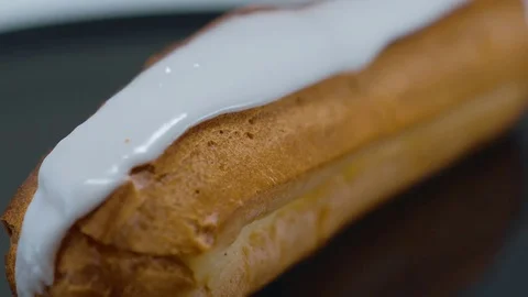 Fresh from the bakery - French Eclair pastry Stock Footage 71746398