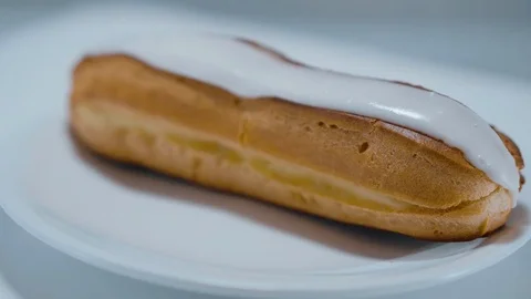 Fresh from the bakery - French Eclair pastry Stock Footage 71746936