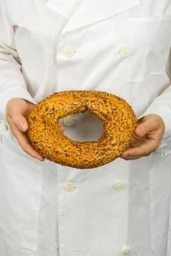 Fresh bakery in the hands of baker Stock Photos
