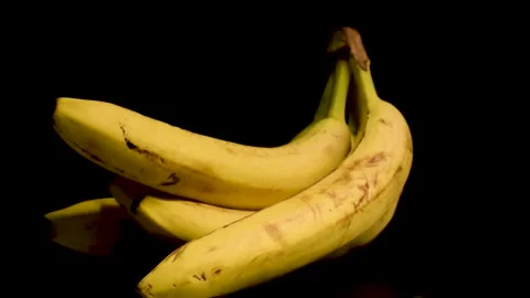 Fresh Bananas in Black Background Stock Footage 230670424