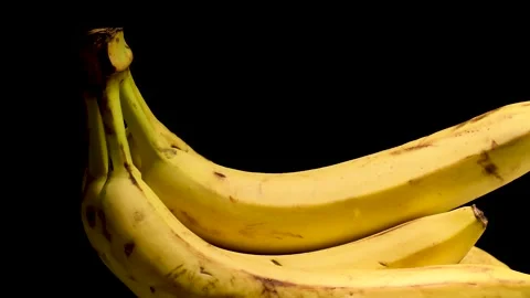 Fresh Bananas in Black Background Stock Footage 230670849