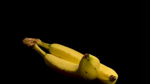 Fresh Bananas in Black Background Stock Footage 230670996