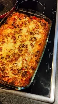 A fresh batch of lasagna cooling on the countertop after baking Stock Photos