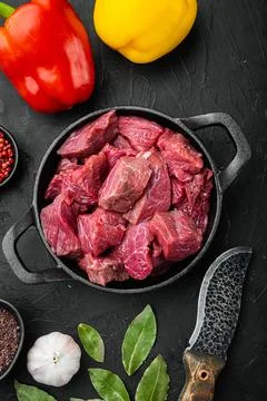 Fresh beef chunks served on table with ingredients ready for cooking with swe Stock Photos