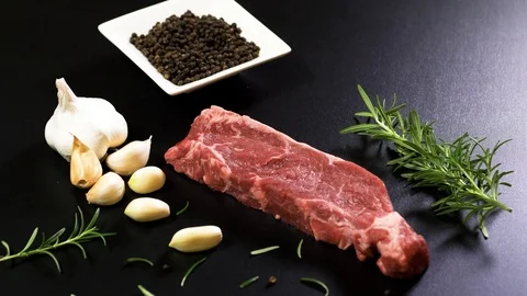 Fresh beef meat on the black table Stockbeeldmateriaal 102609541