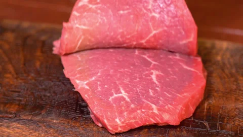 Fresh beef meat for cooking, cut with a knife Stock Footage 249732456