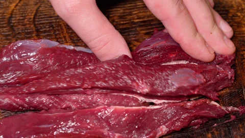 Fresh beef meat for cooking, cut with a knife Stock Footage 252067285