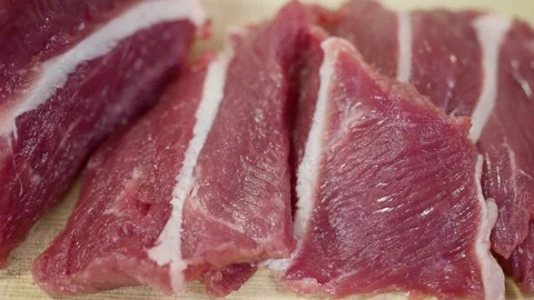 Fresh beef is sliced on natural background. Video stock 266649000