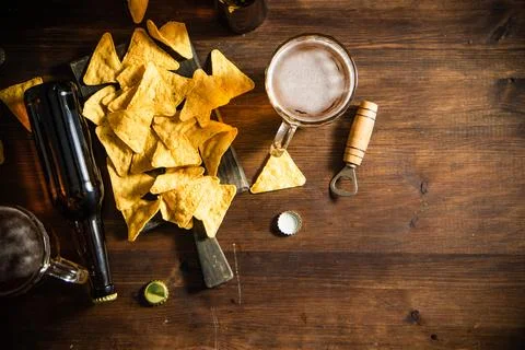 Fresh beer with corn chips. Stock Photos